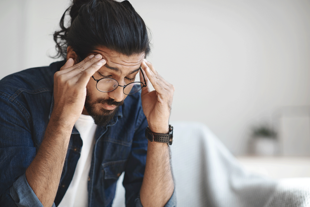 young man looking distressed as he contemplates fentanyl withdrawal symptoms